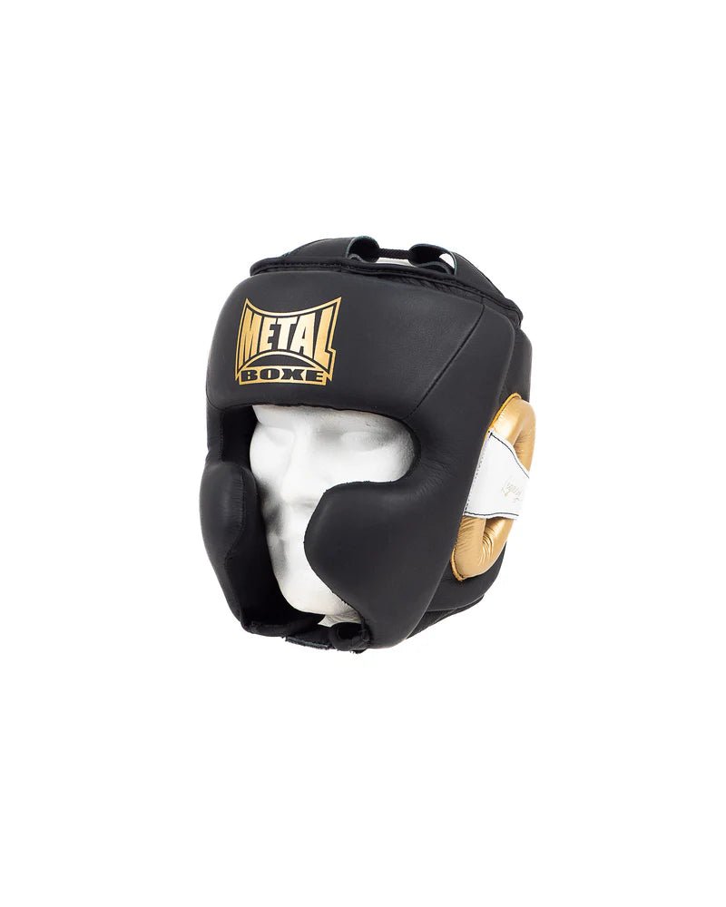 Vista frontal del casco Metal Boxing Legacy en cuero negro y dorado, diseño profesional