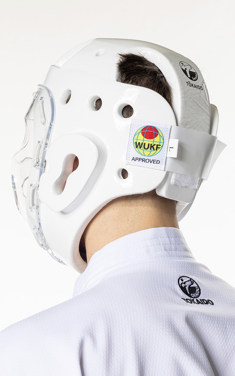 Protezione testa per karate bambino con maschera in plexiglass e chiusura a velcro.