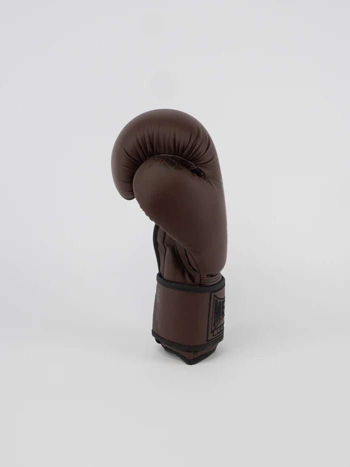 Side view of Steel Brown Metal Boxing gloves, velcro closure detail and wrist support