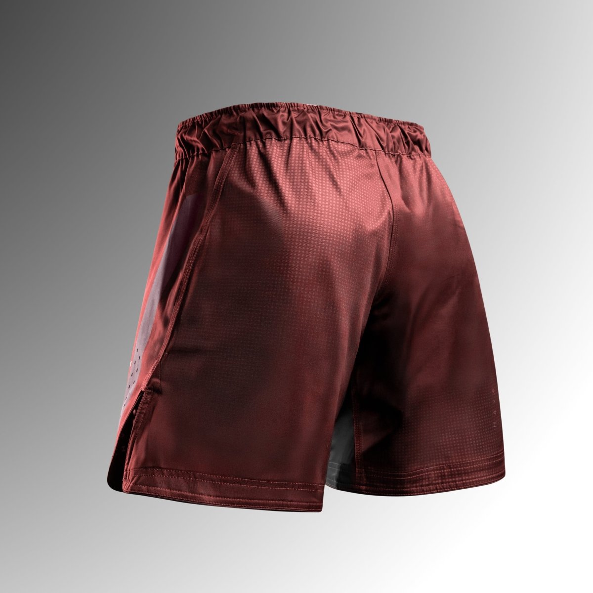 Rear view of the red Hayabusa Core Mid-Thigh MMA shorts in tear-resistant fabric for No-Gi
