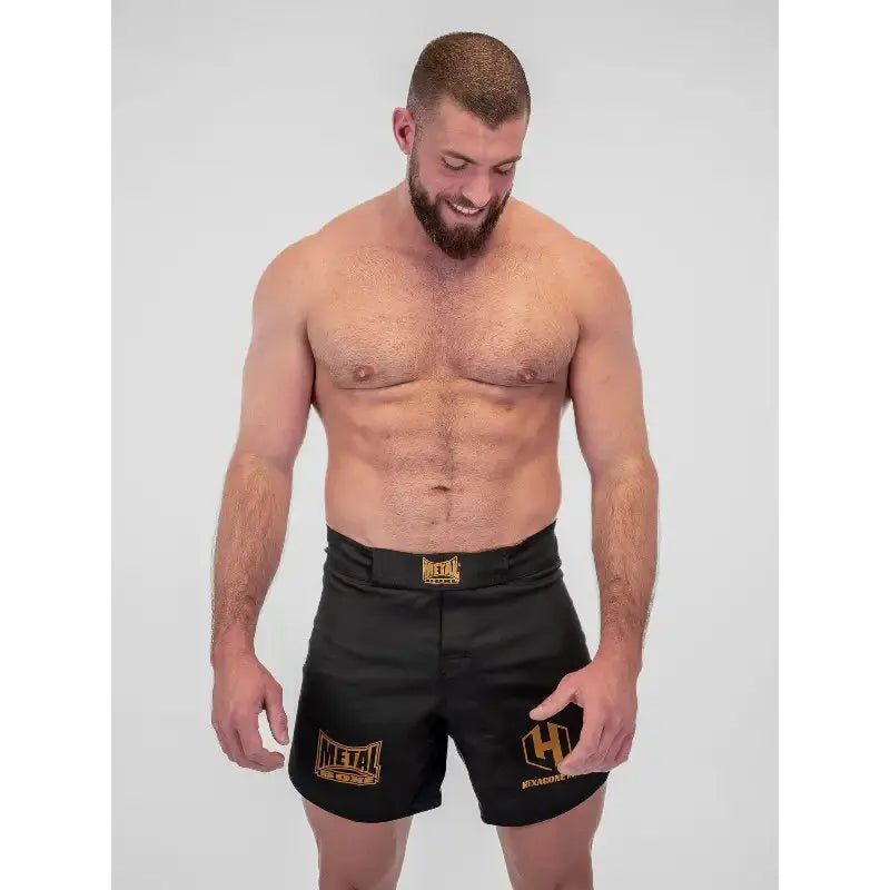 Szczegóły dotyczące wytrzymałego materiału i technicznych wykończeń Spodenki MMA SPE Hexagon