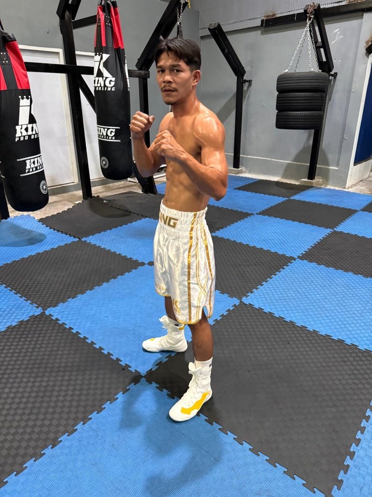 Professional boxer wears the white KPB XK shorts, showing the contrast of the logos and the breathability of the fabric
