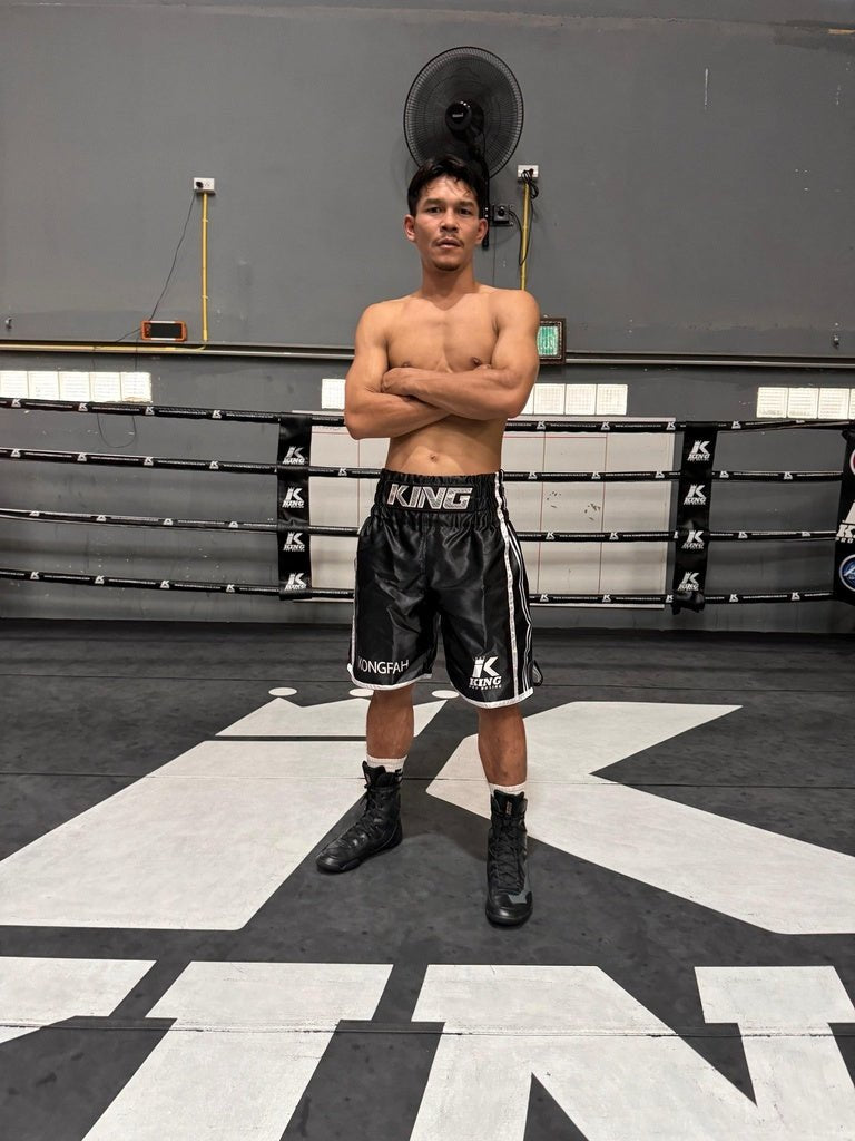 Athlete wears black King Pro Boxing XK professional boxing shorts during a boxing session