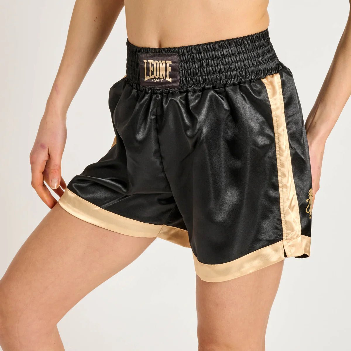 Front view of the black Leone 1947 DNA shorts with satin finish and golden logo