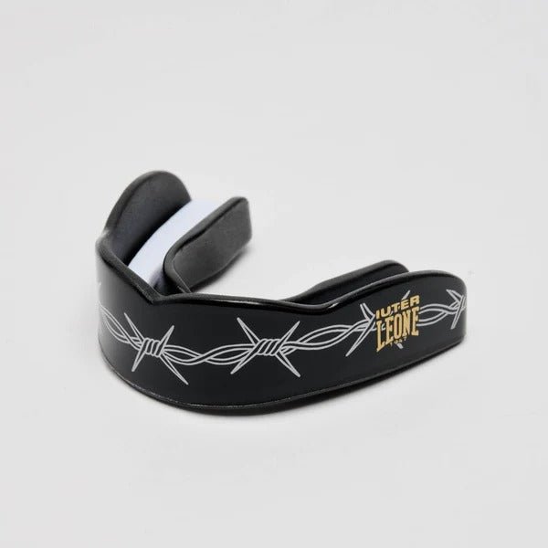 Leone x Iuter Barbed Wire black mouthguard with barbed wire graphics and gold logo in perspective