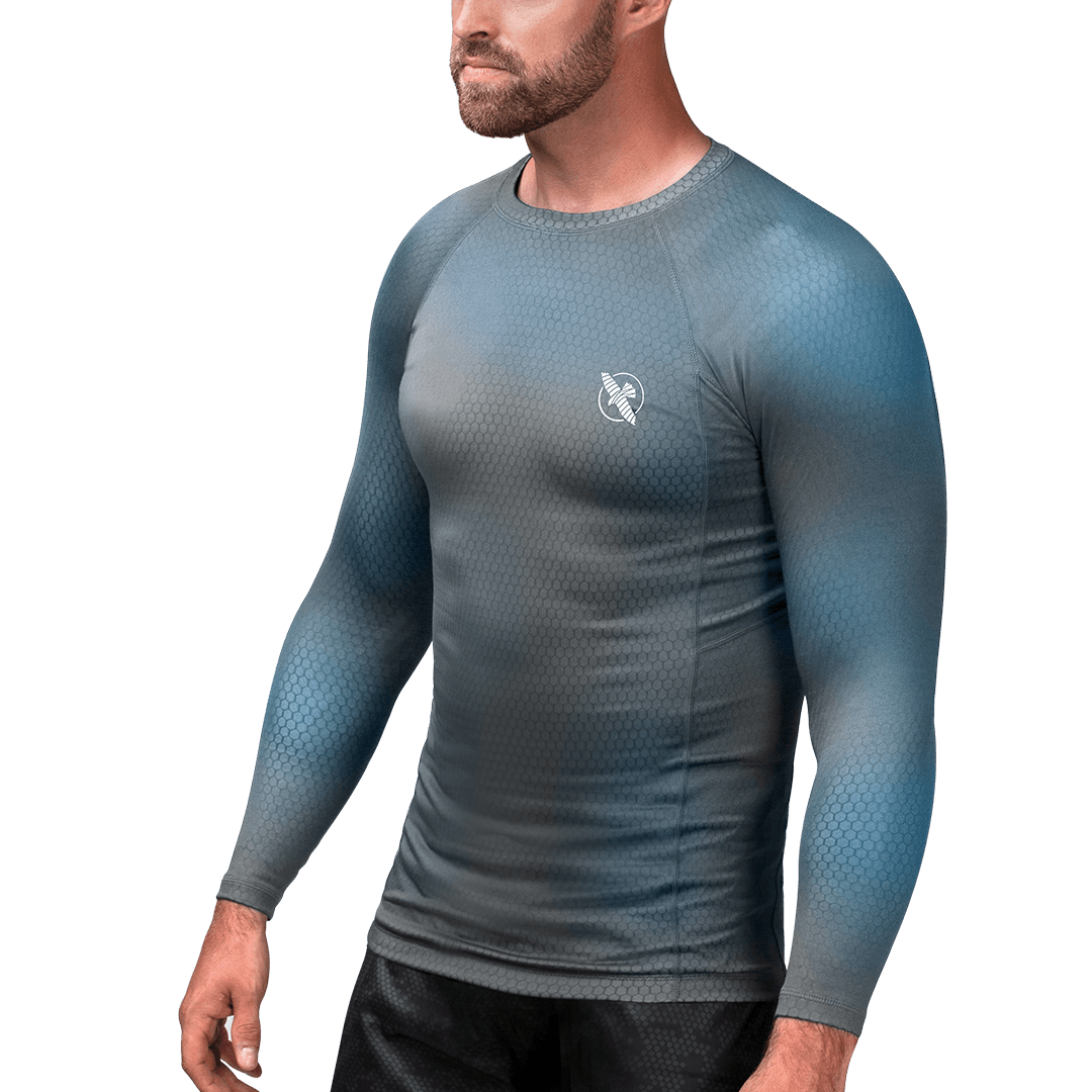 Front view of the gray and light blue Hayabusa Fusion rash guard, long-sleeved sweat-wicking technical fabric