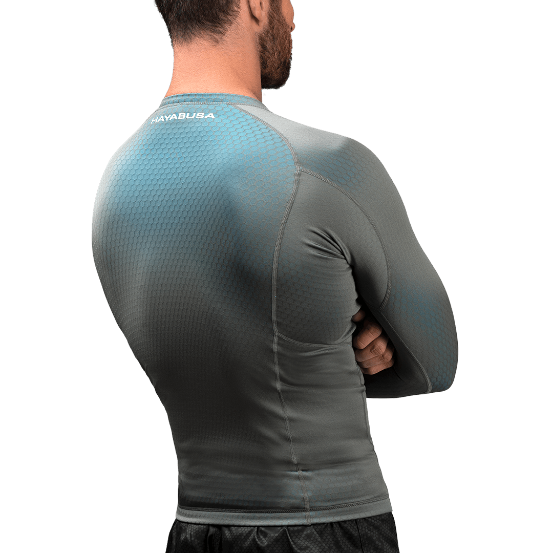 Rear view of the gray/light blue Hayabusa Fusion rash guard, aerodynamic design for Jiu Jitsu