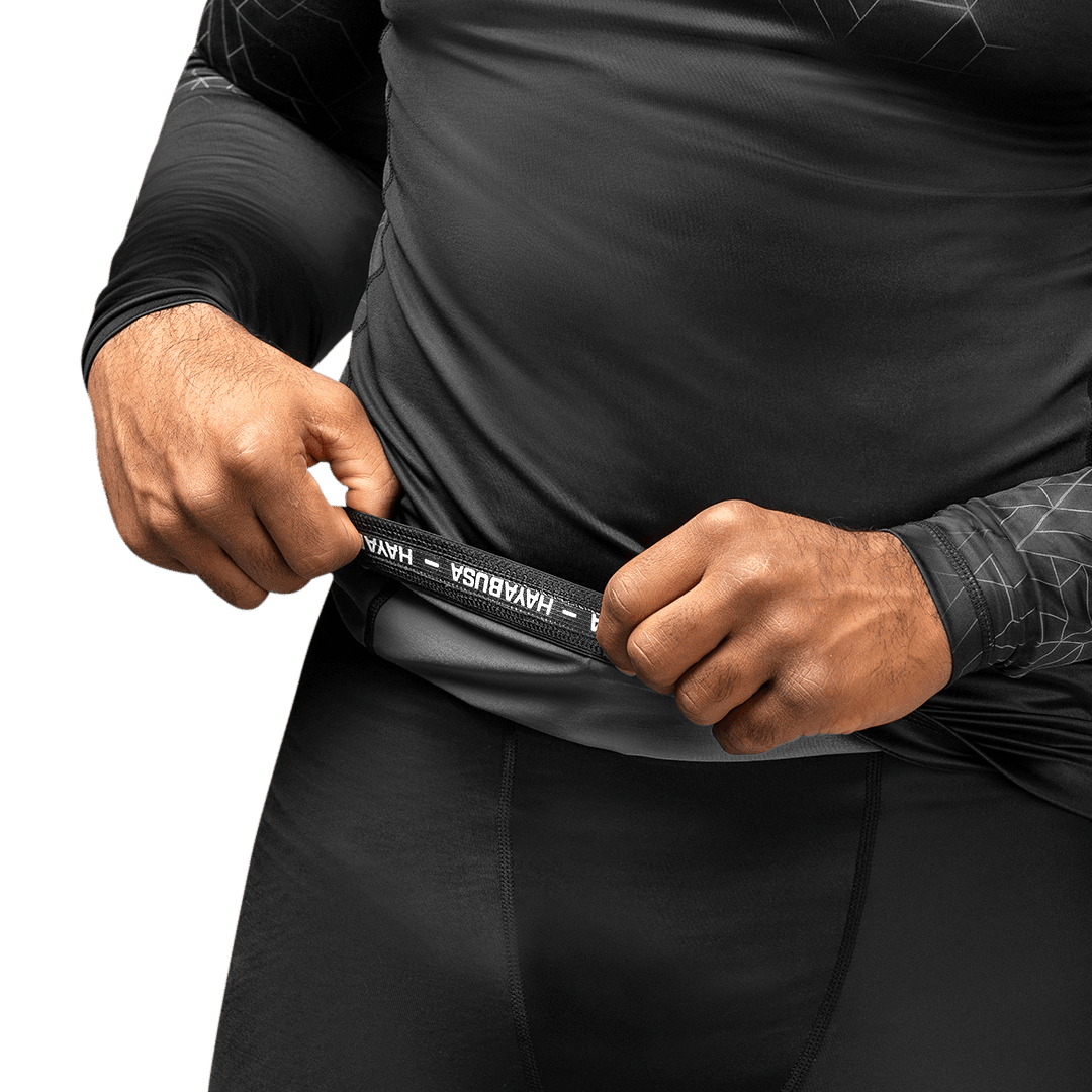 Internal writing detail of the gray Hayabusa Geo rashguard, ergonomic and protective design