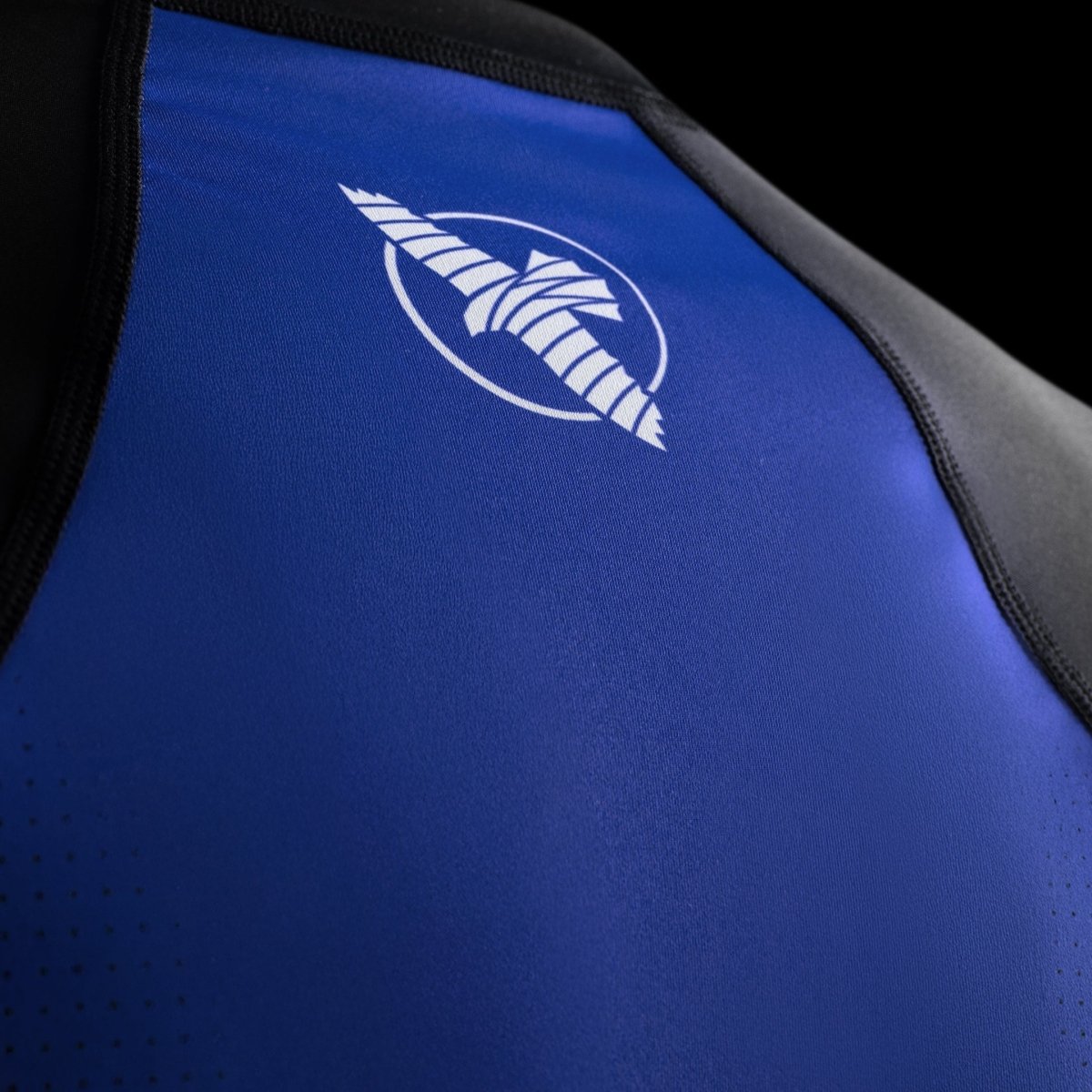Close-up detail of the Hayabusa graphics and logo on the blue Pro Ranked short-sleeved rashguard