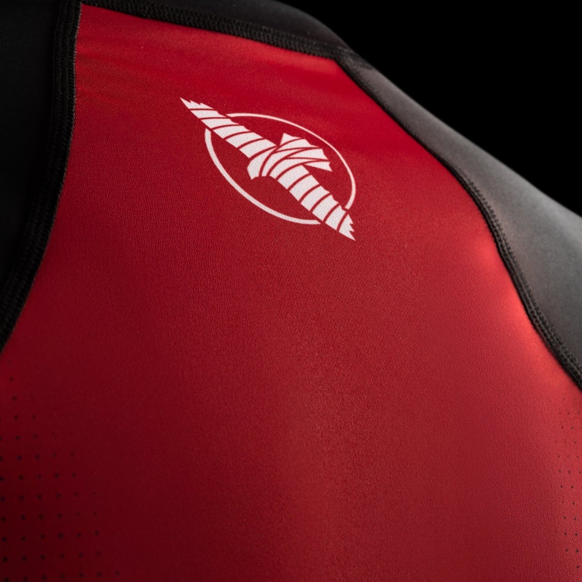 Close up of the Hayabusa logo on the black Pro Ranked short sleeve rashguard for competitive BJJ