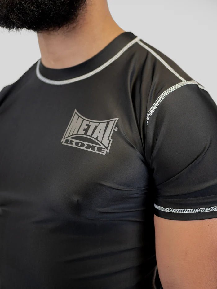 Front detail of men's Metal Boxing rashguard, focus on non-slip rubber elastic band