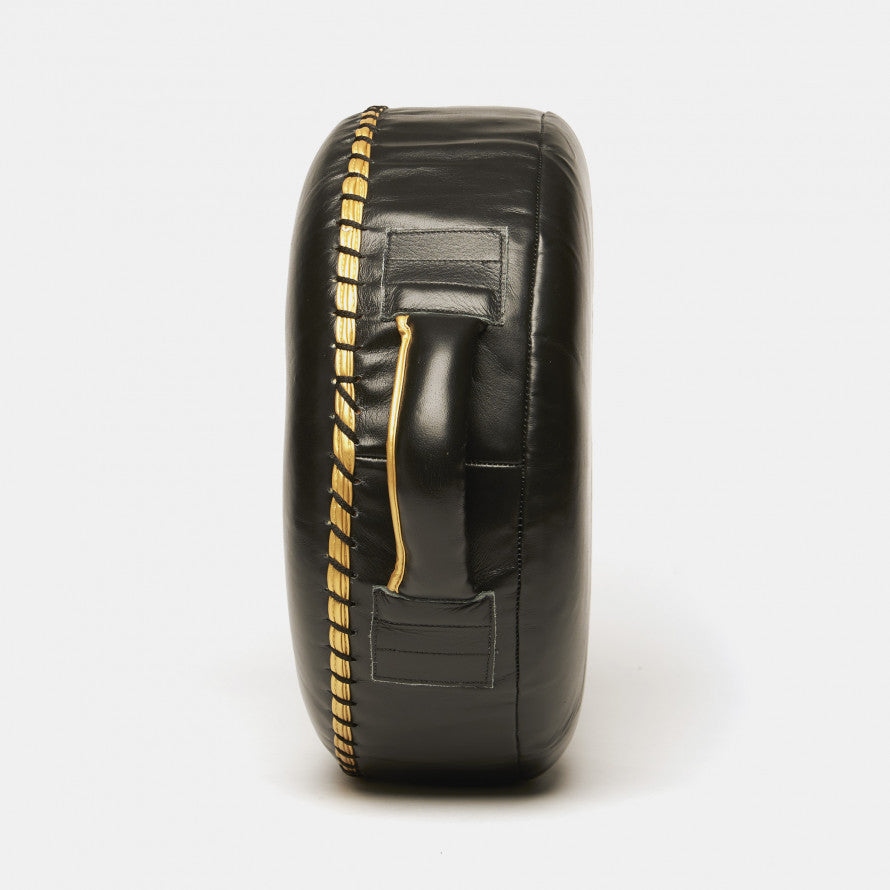 Rundes Schild Löwenhände