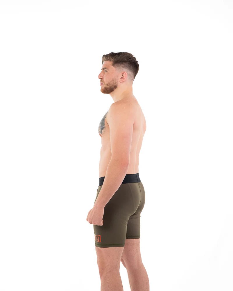Vista trasera pantalón corto de compresión para hombre Metal Boxe tejido ultraflexible verde