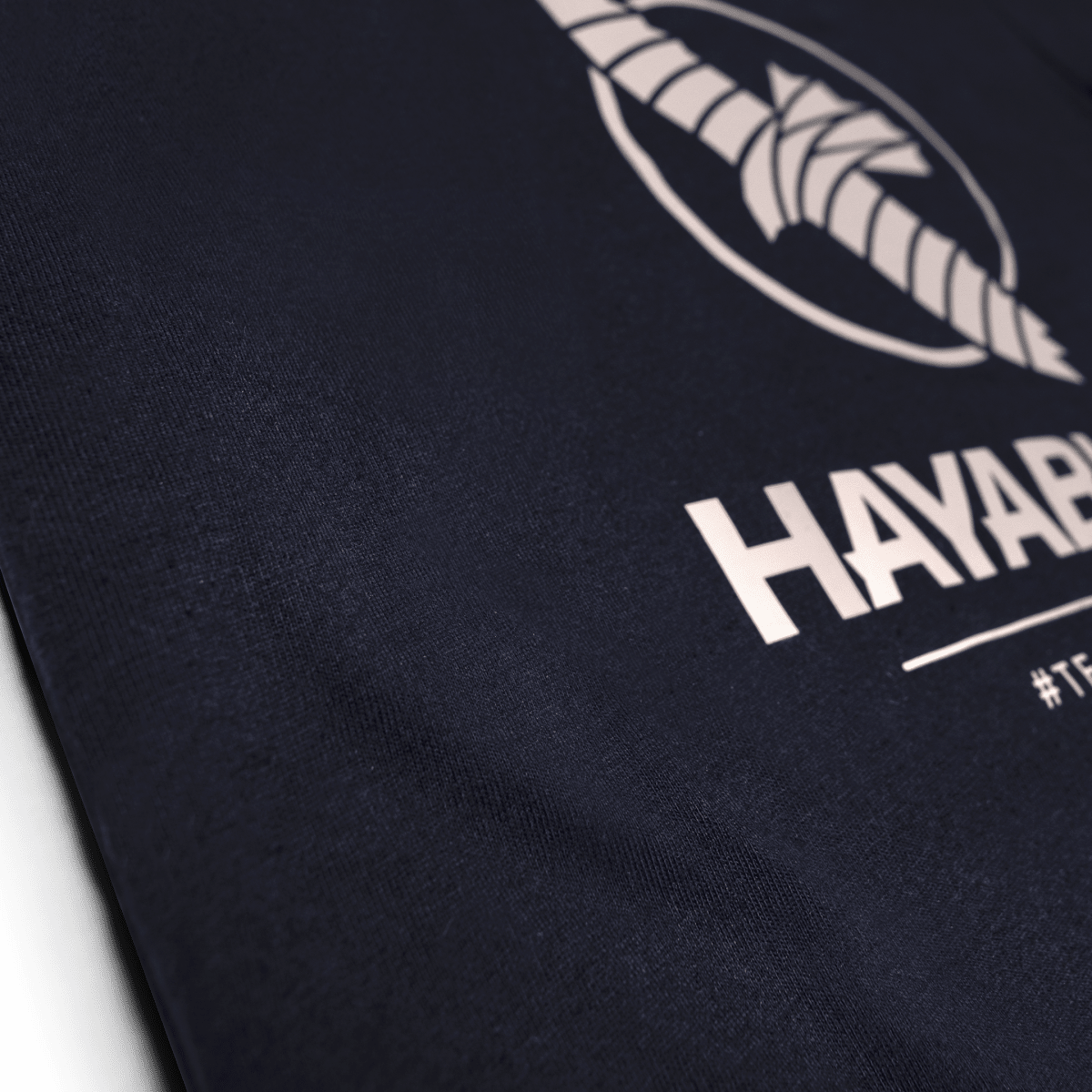 Close-up of the Team Hayabusa silicone graphic on the midnight blue t-shirt