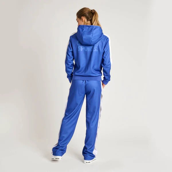 Vista trasera del mono de mujer Leone Stripe azul que resalta el corte moderno