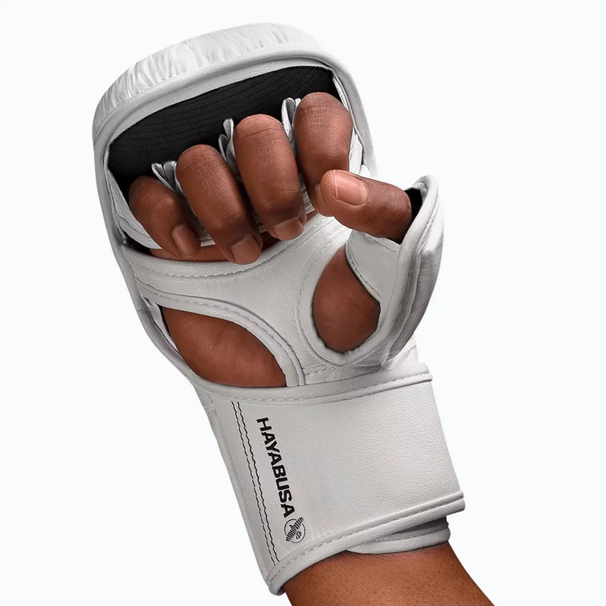 Detail of the patented Dual-X double closure on the white Hayabusa gloves to prevent wrist injuries.