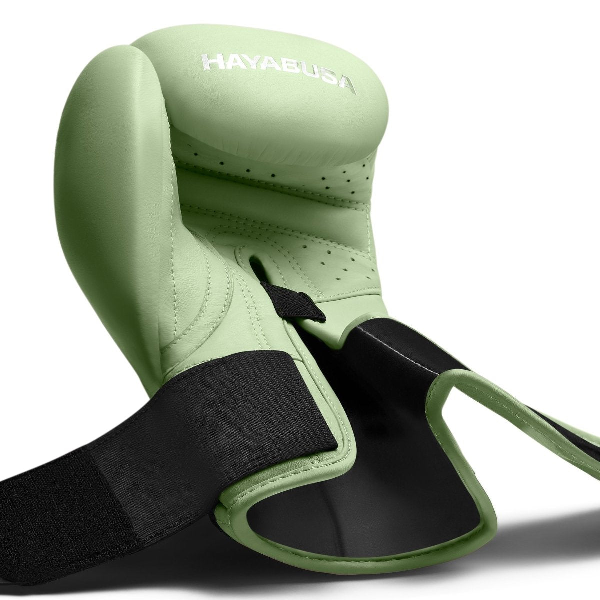 Détail technique de la fermeture déboutonnée du gant Kanpeki vert