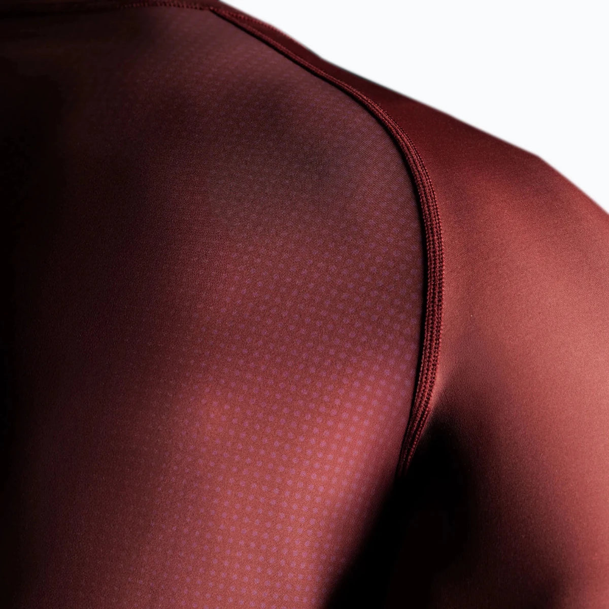 Hayabusa burgundy rash guard detail on sides and sleeves.