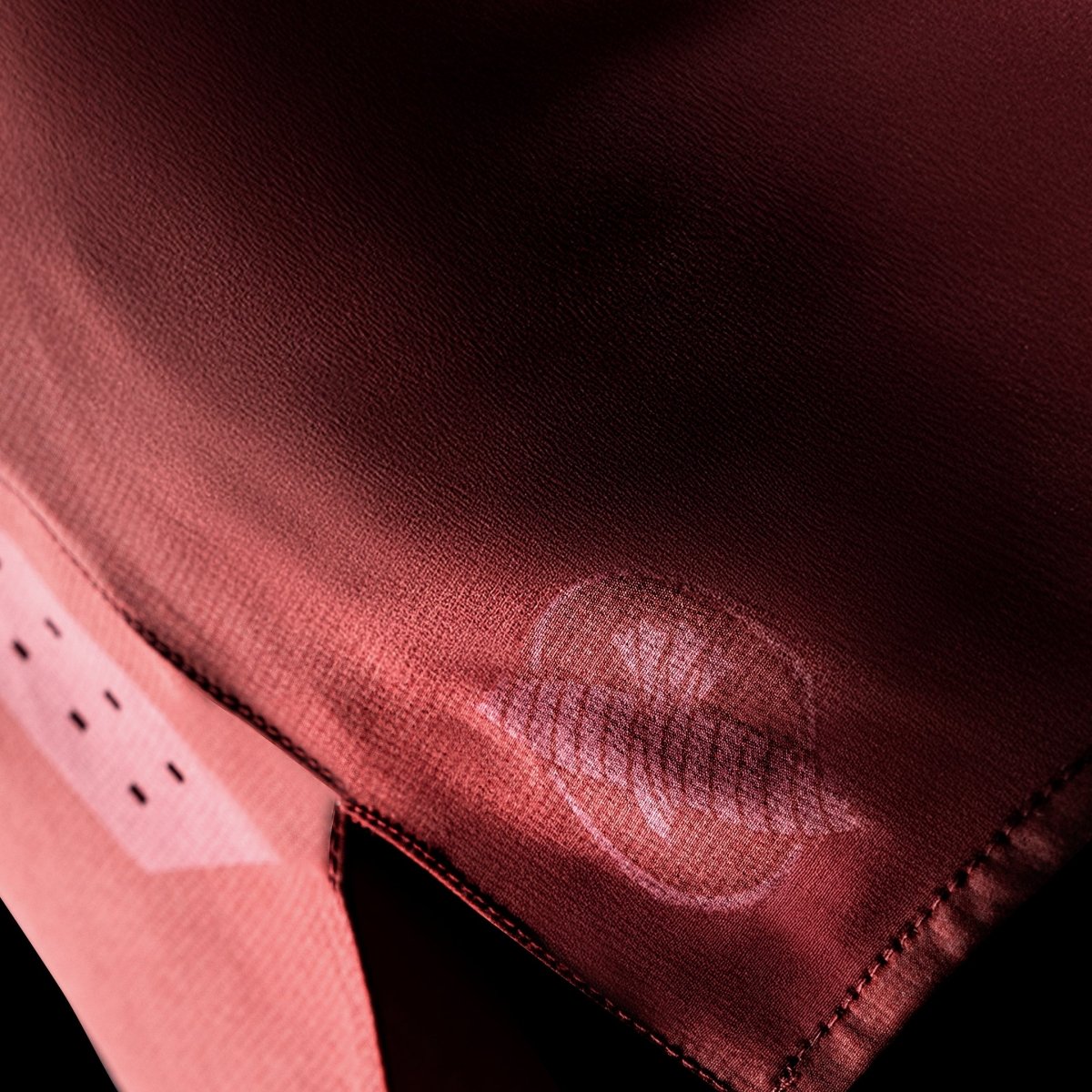 Side detail of the red Hayabusa Core grappling shorts, focus on the elasticated structure