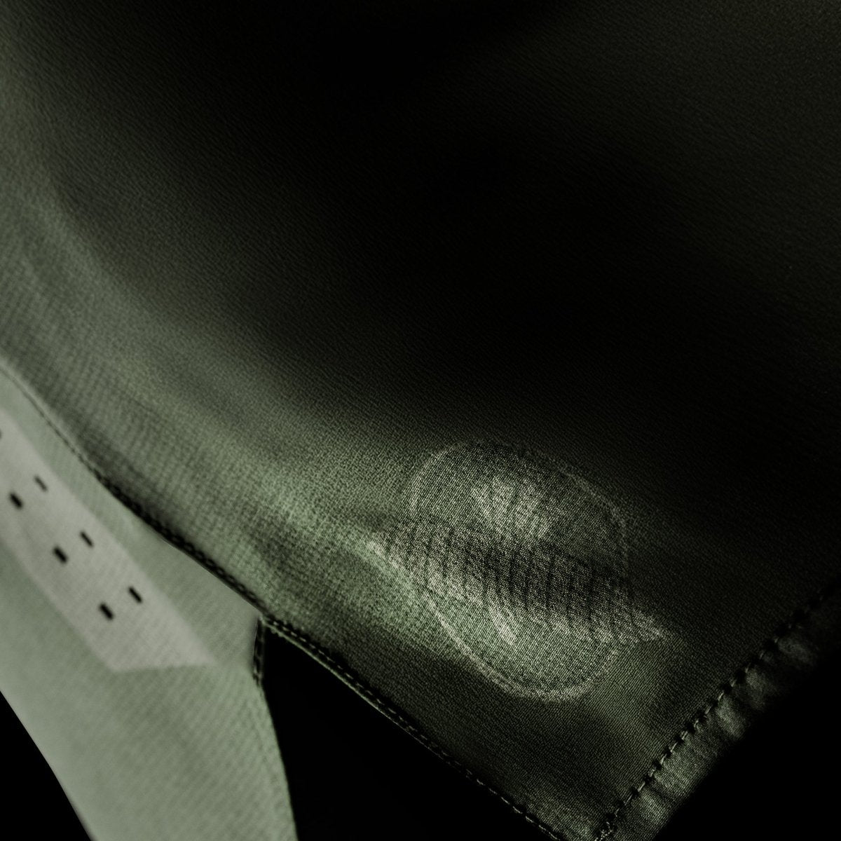 Side detail of the green Hayabusa Core grappling shorts, showing the hem finish and ventilation