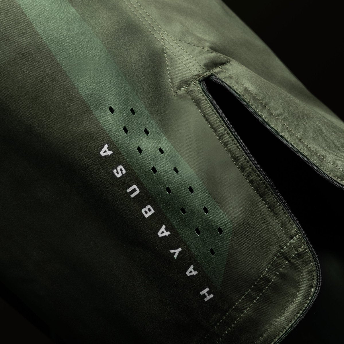 Side view of the green Hayabusa Core Full-Length MMA Shorts, detail of the full length fit