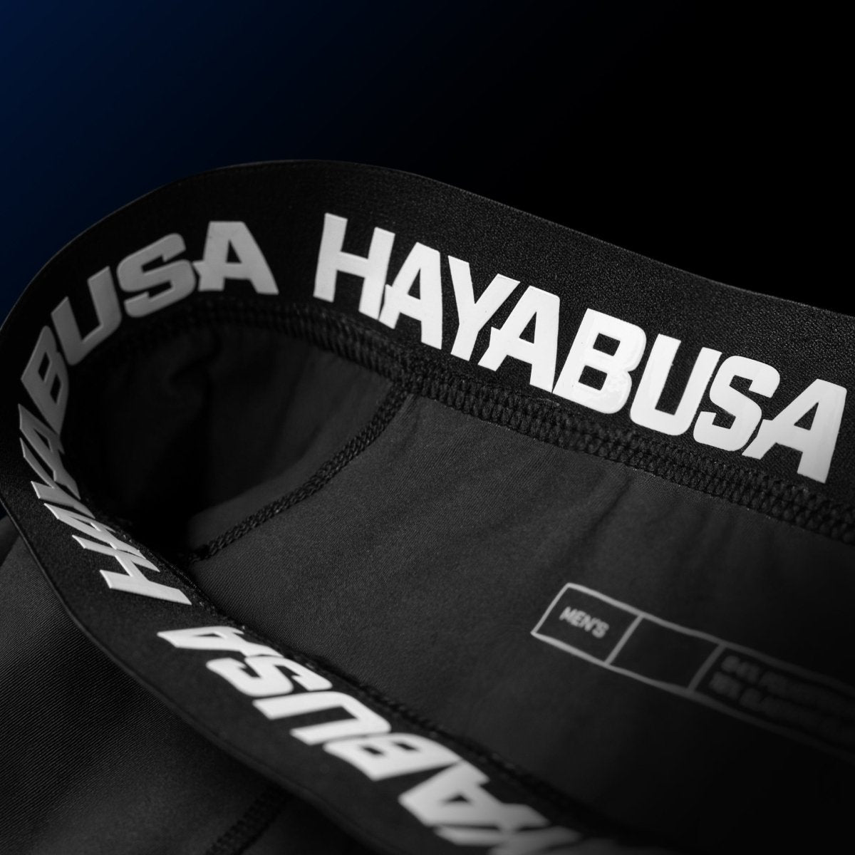 Détail de la fermeture et de la doublure interne en silicone du short bleu UFC BJJ