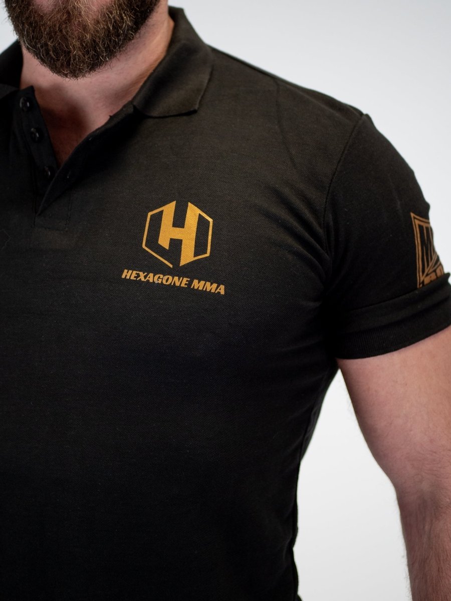 Detail of the collar and the Hexagon MMA logo embroidery on the black Metal Boxe polo shirt