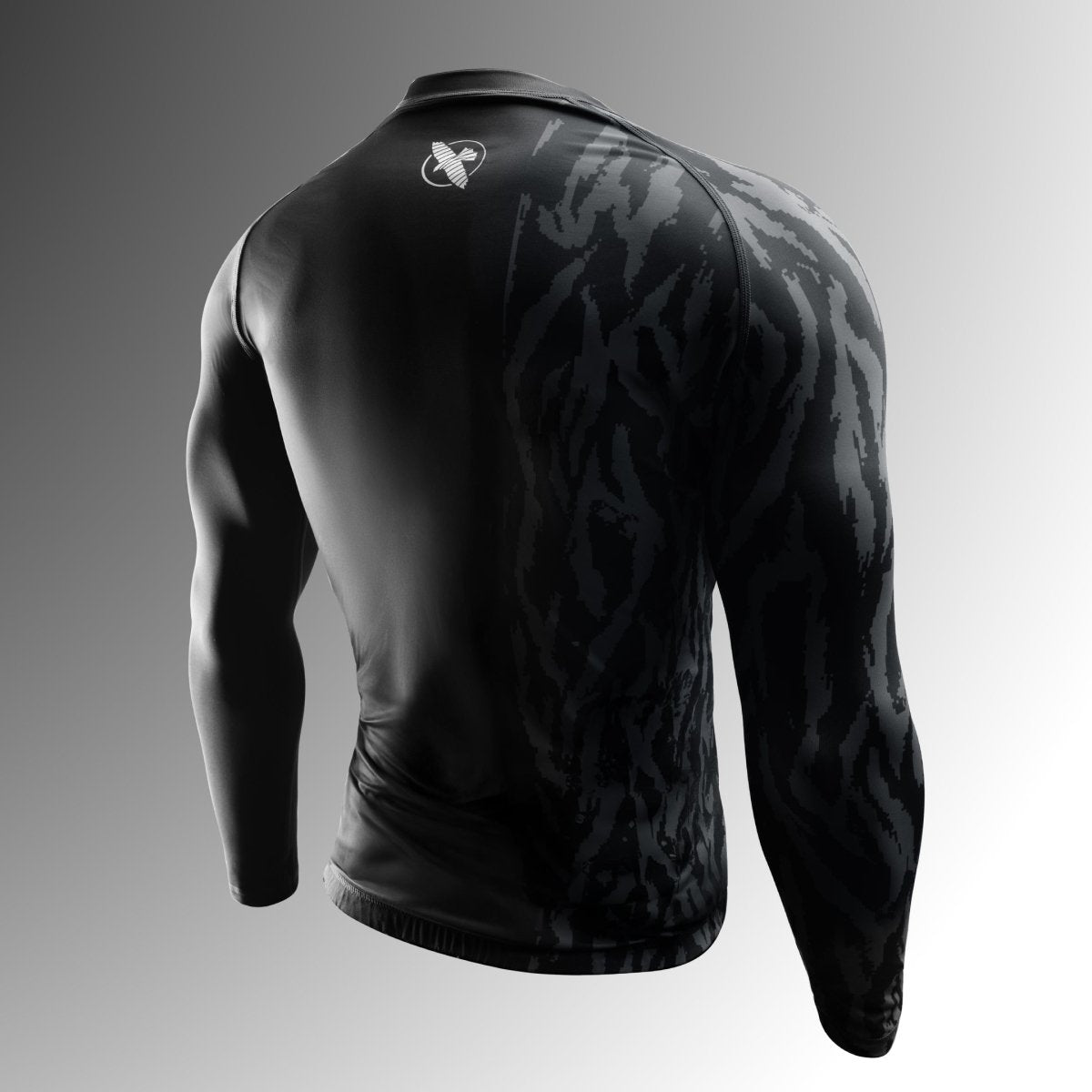 Rear view of the black Hayabusa Apex rash guard, highlights the ergonomic cut and reinforced stitching