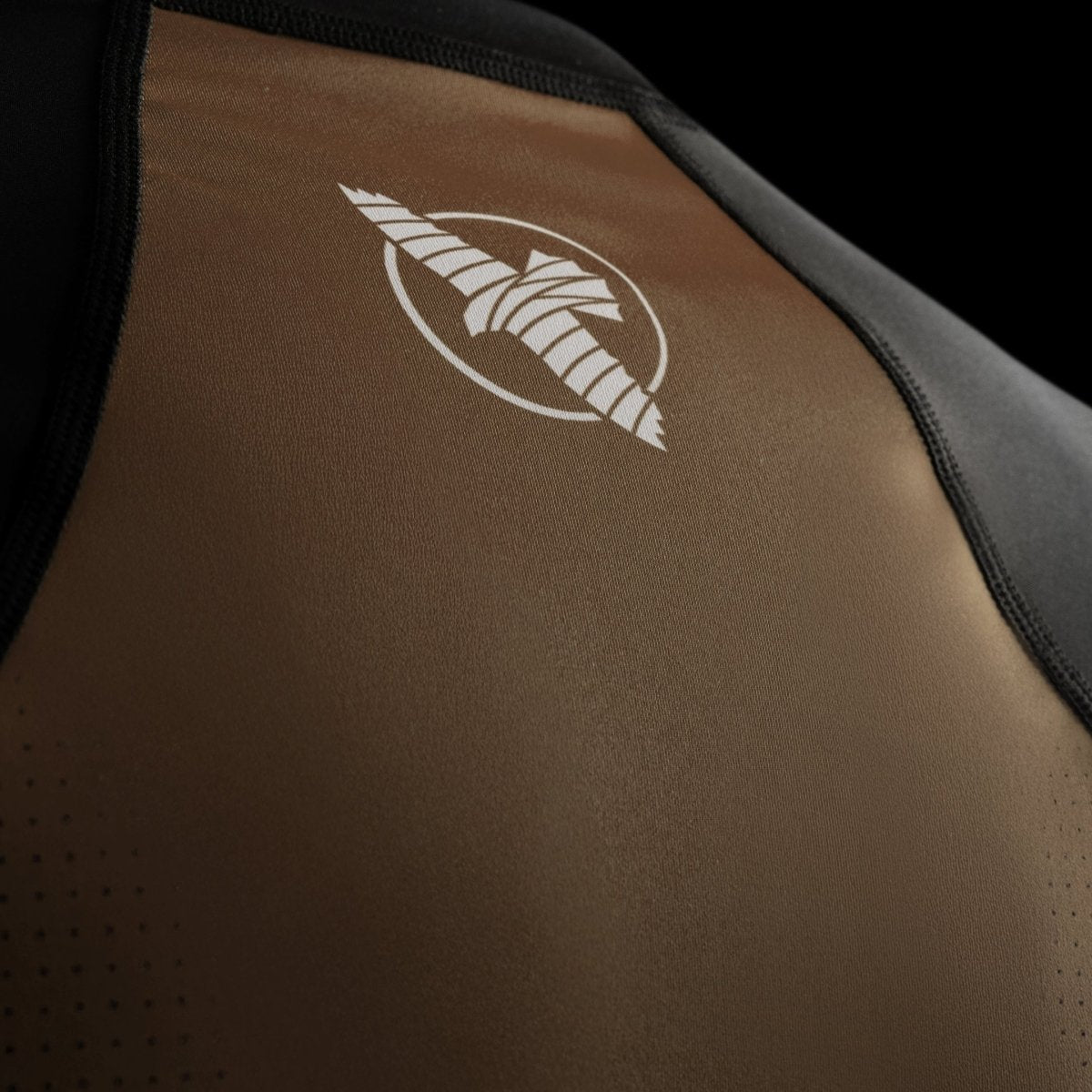 Technical detail of the Hayabusa logo printed on the brown Pro Ranked short-sleeved rashguard